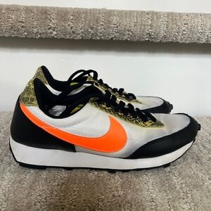 Nike Black and White Sneakers with Orange Swoosh